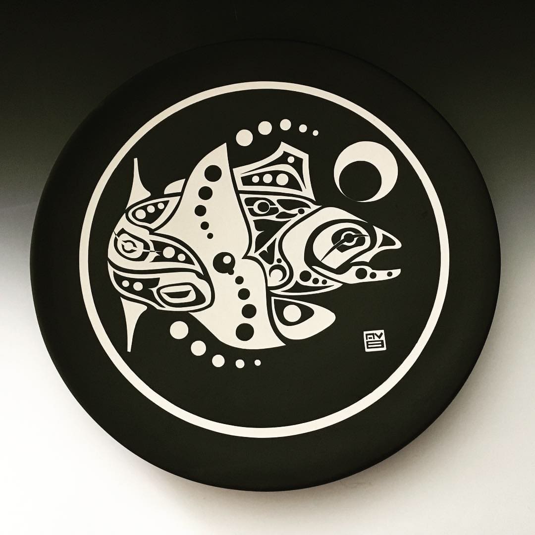 A black and white picture of a plate with an animal design.