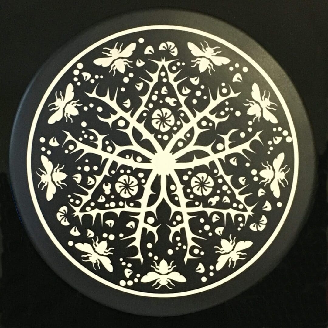 A black and white picture of a round plate