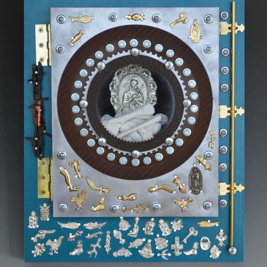 A blue book with gold and silver embellishments.